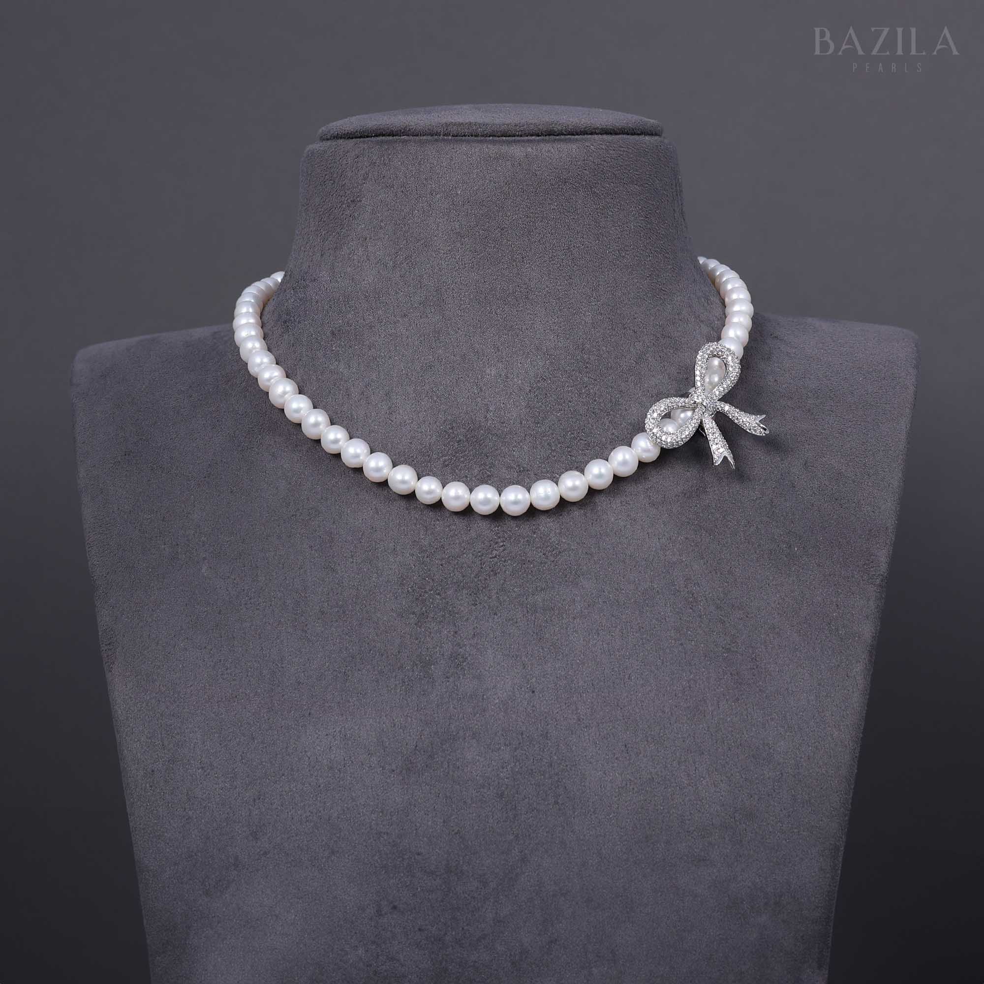 Delicate Pearl Necklace with Zircon Bow Accent