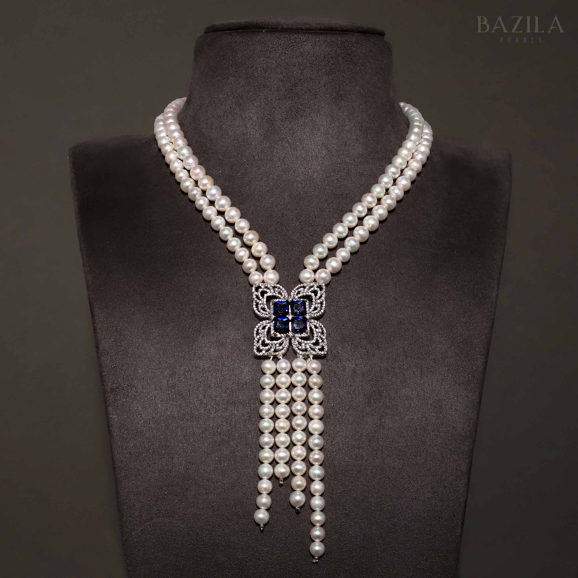 Elegant Pearl Necklace with Sapphire and Zircon Floral Centerpiece