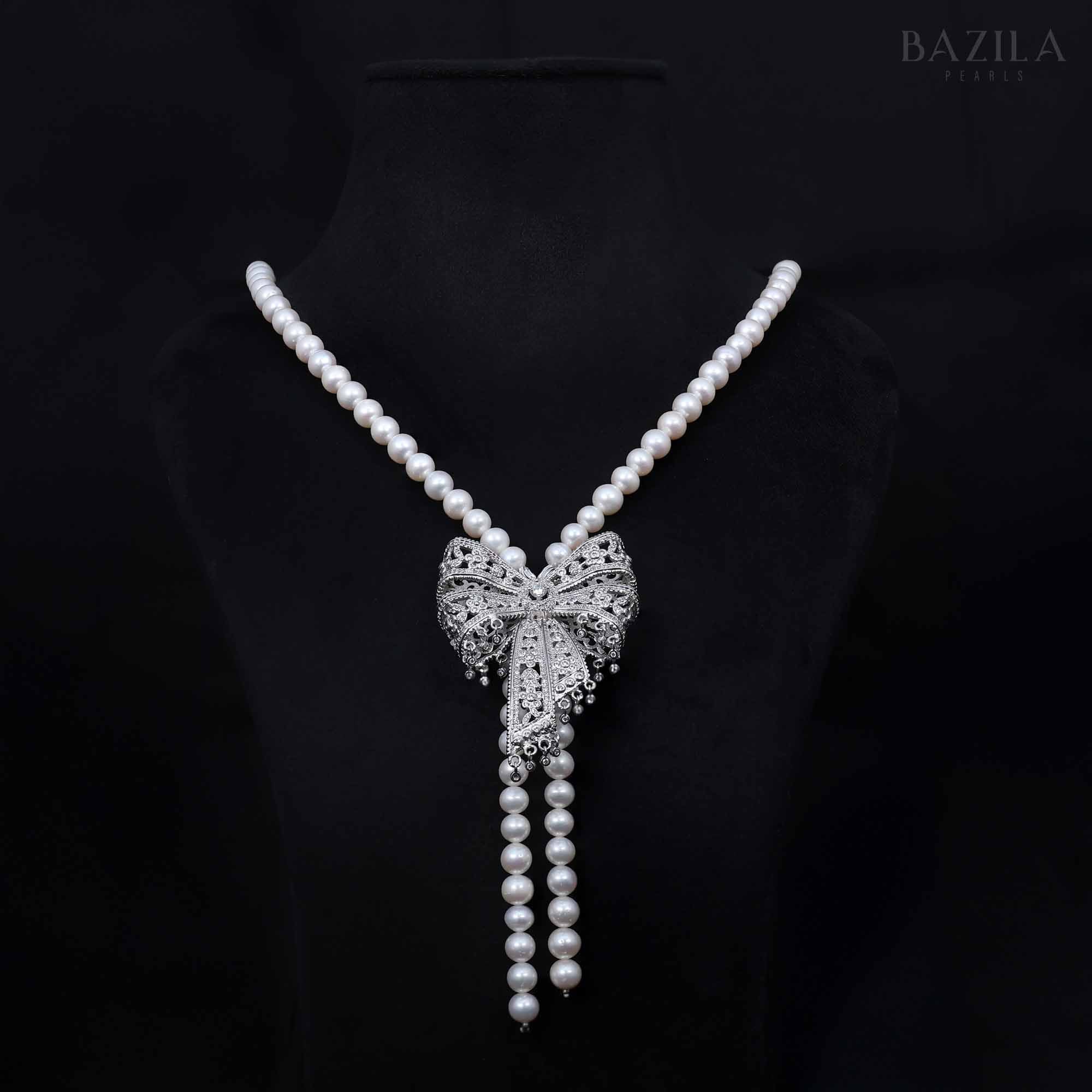 Lustrous Pearl Necklace with Ornate Bow Zircon Pendant