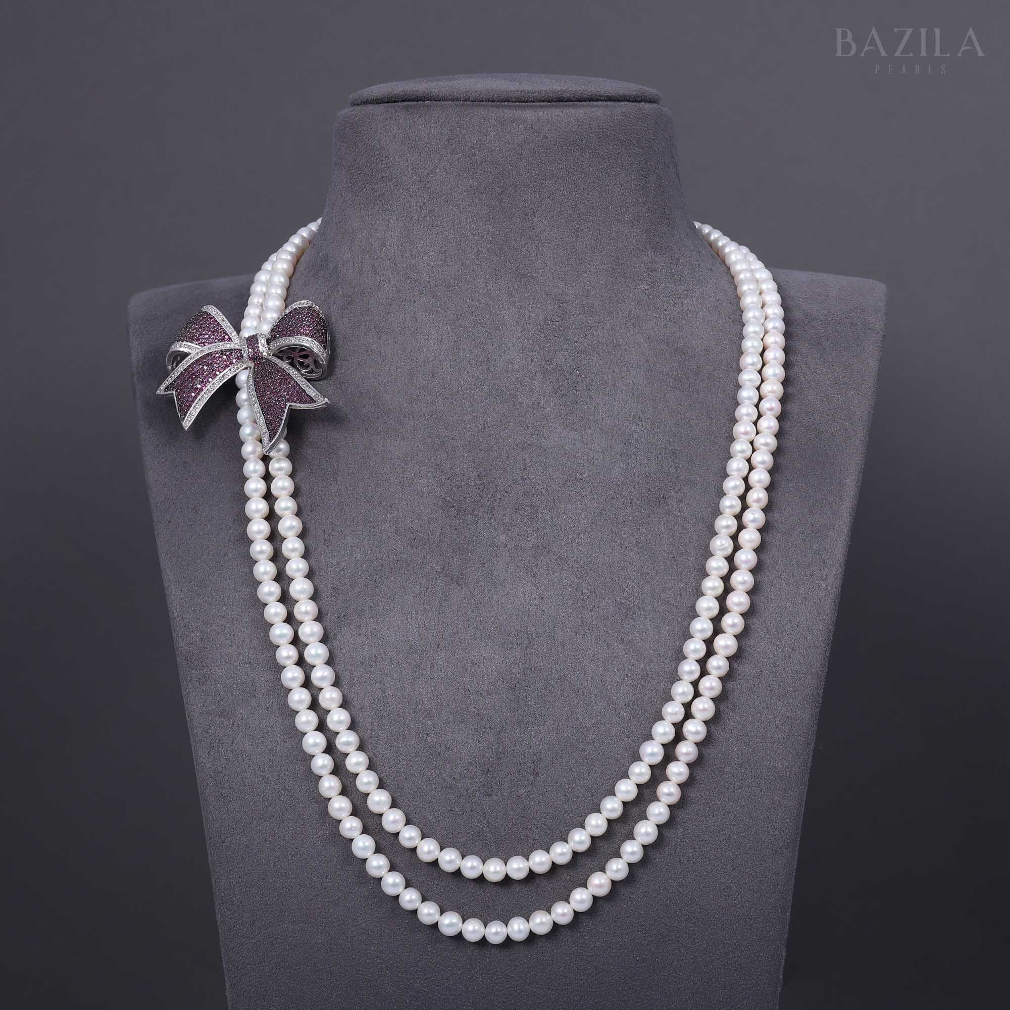 Layered Pearl Necklace with Embellished Bow Accent
