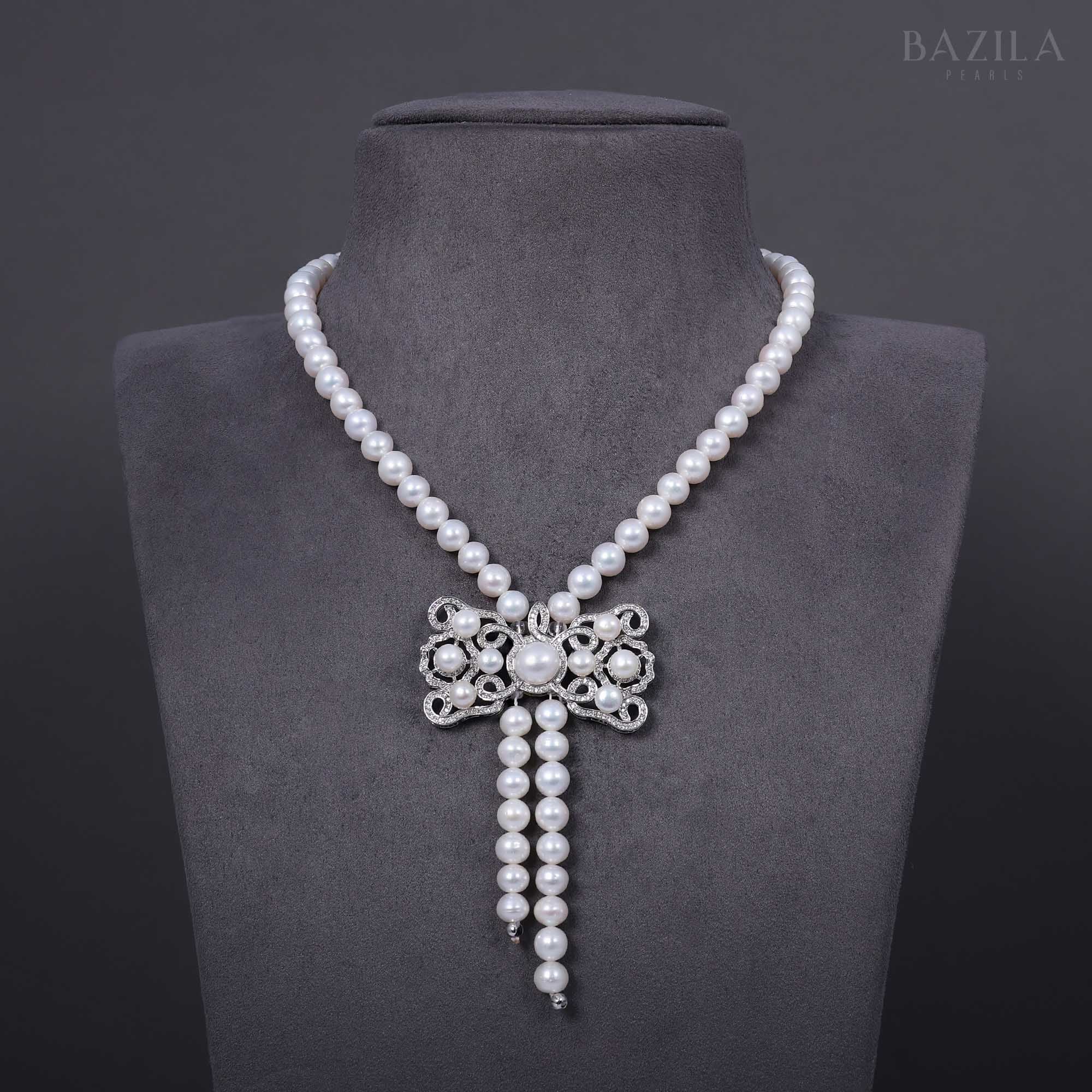 Pearl Necklace with Ornate Bow Zircon Centerpiece
