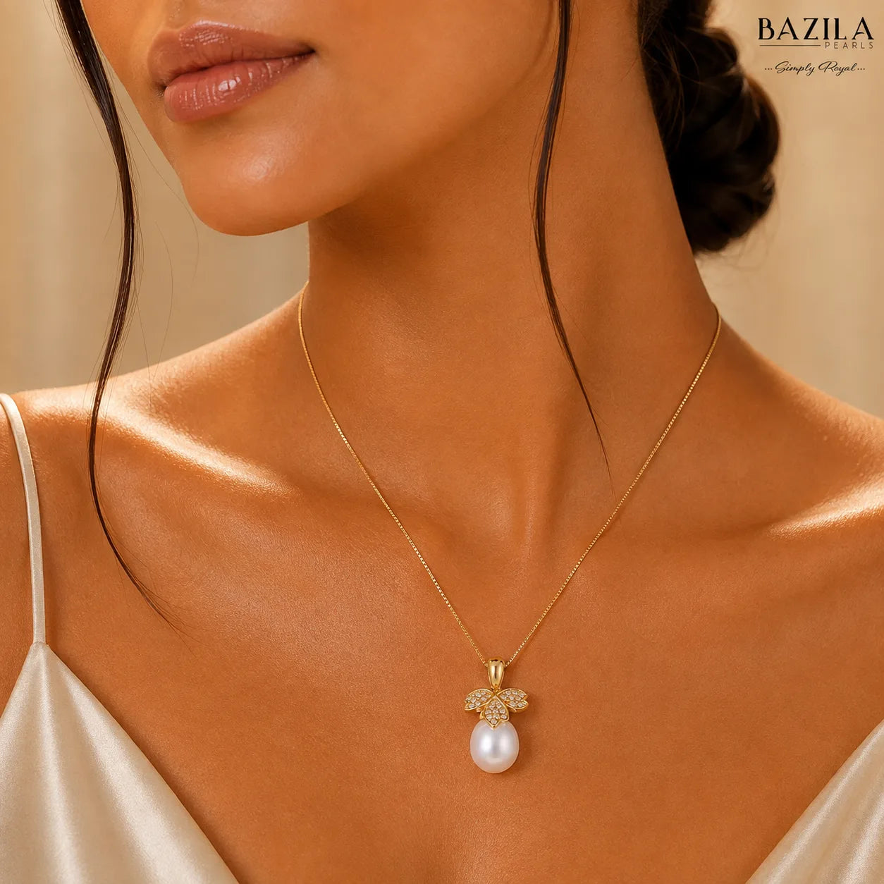 White Drop Pearl Pendant with Butterfly Motif on Gold-Finish Chain