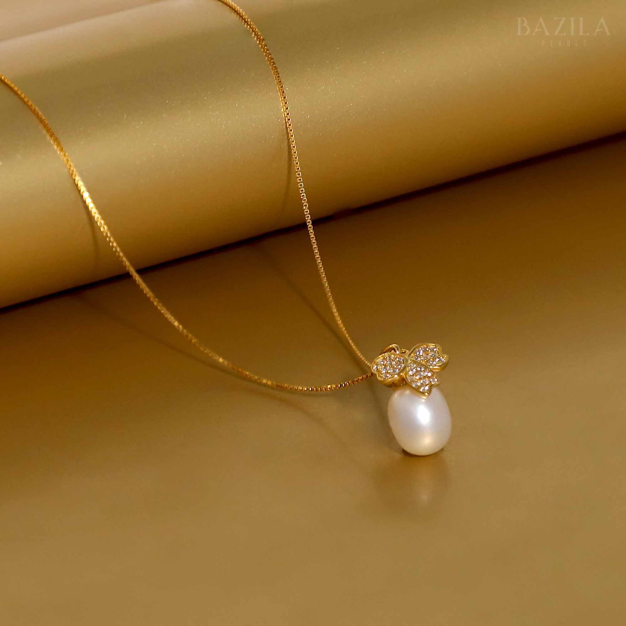 White Drop Pearl Pendant with Butterfly Motif on Gold Chain