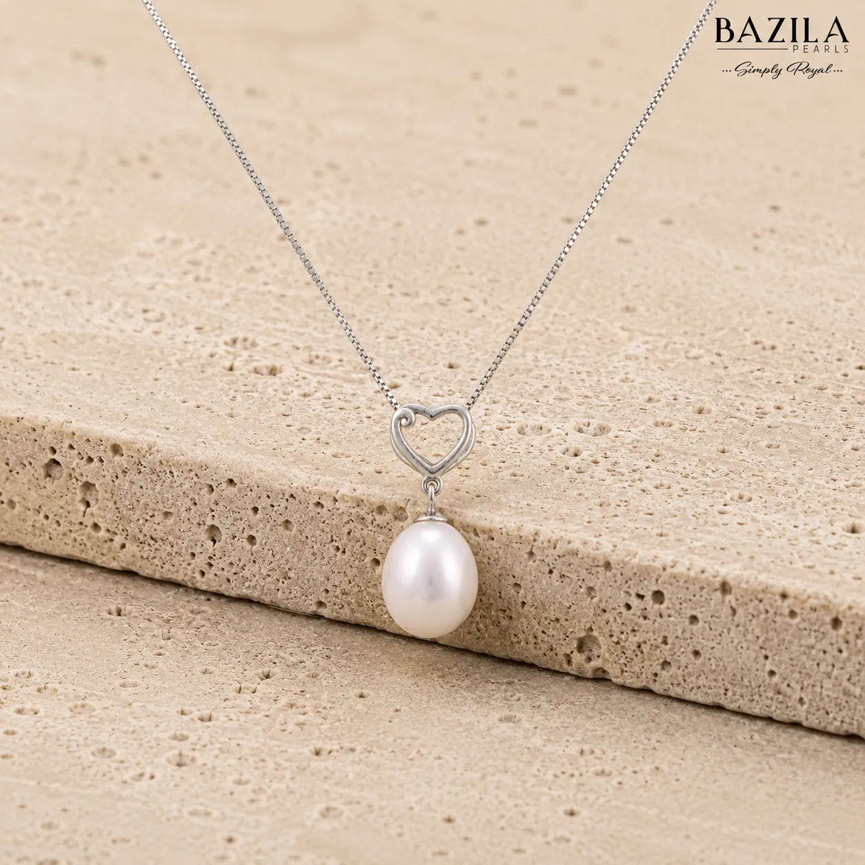 White Drop Pearl Pendant with Heart-Shaped Silver Detail