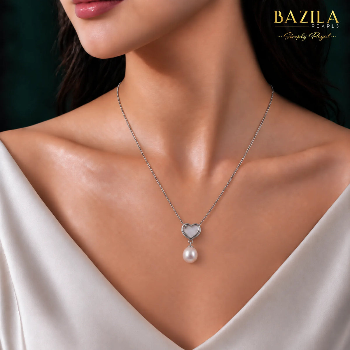 White Drop Pearl Pendant with Heart-Shaped Silver Detail