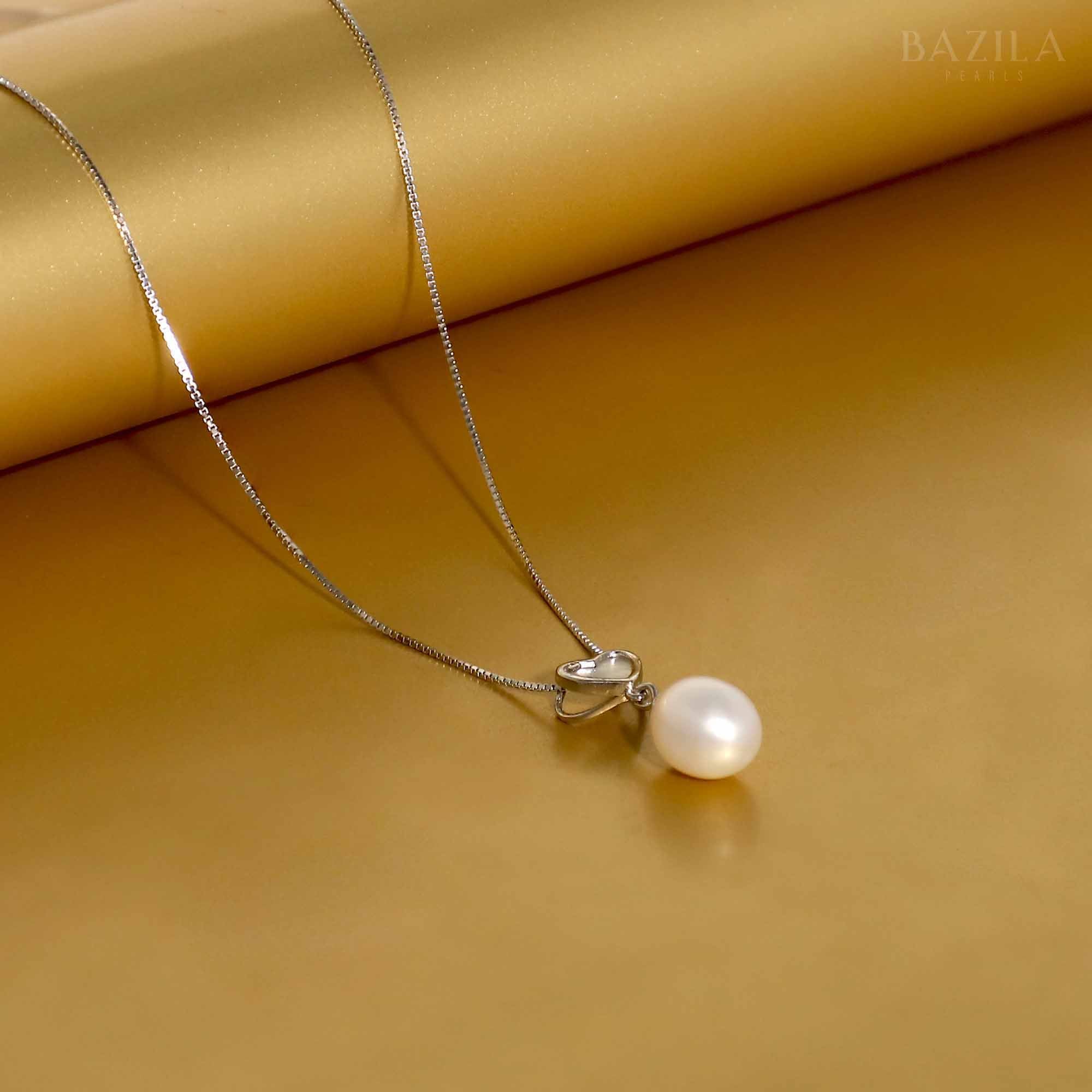 White Drop Pearl Pendant with Heart-Shaped Silver Detail
