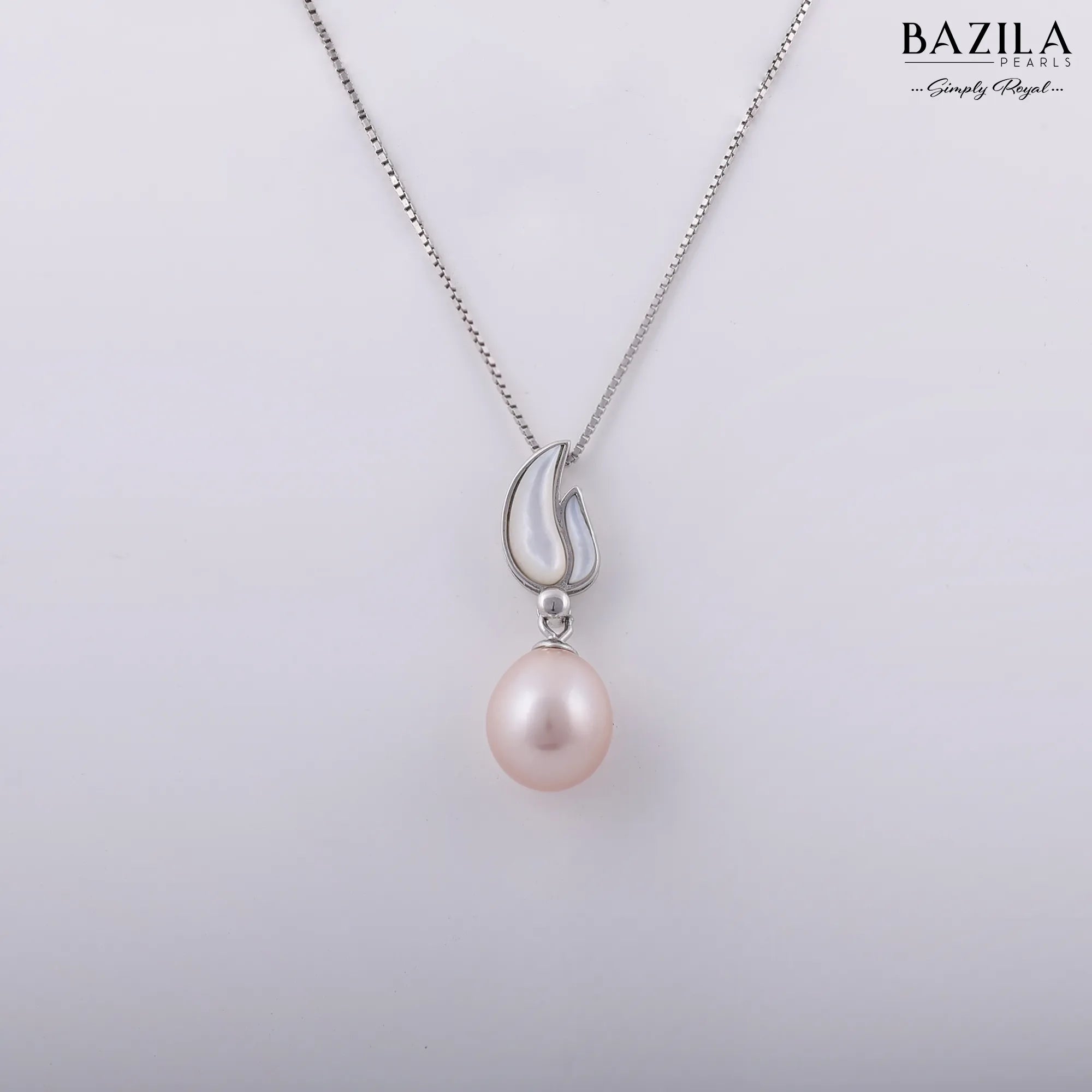Delicate Pink Pearl Pendant in a Silver Tulip Petal Setting