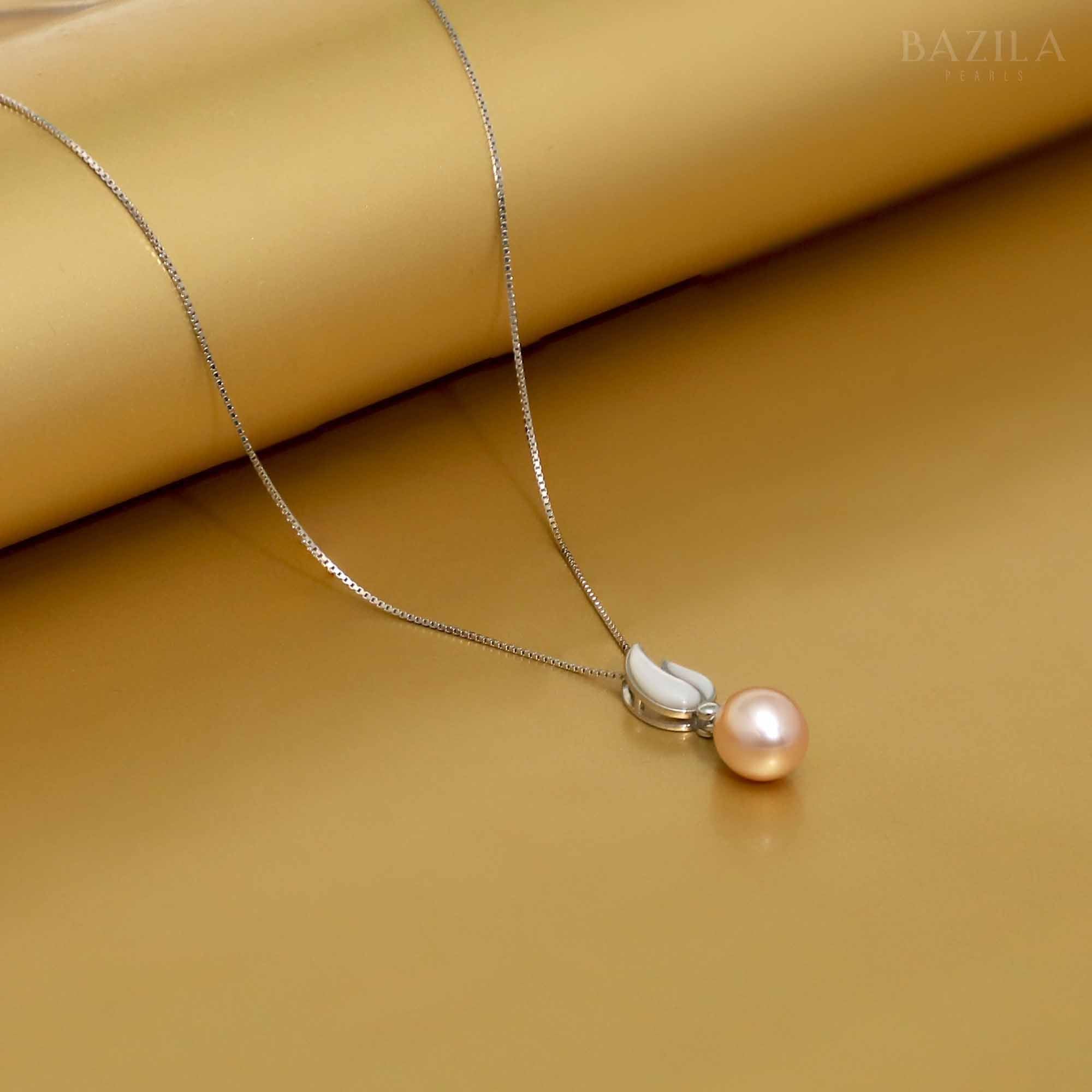 Delicate Pink Pearl Pendant in a Silver Tulip Petal Setting