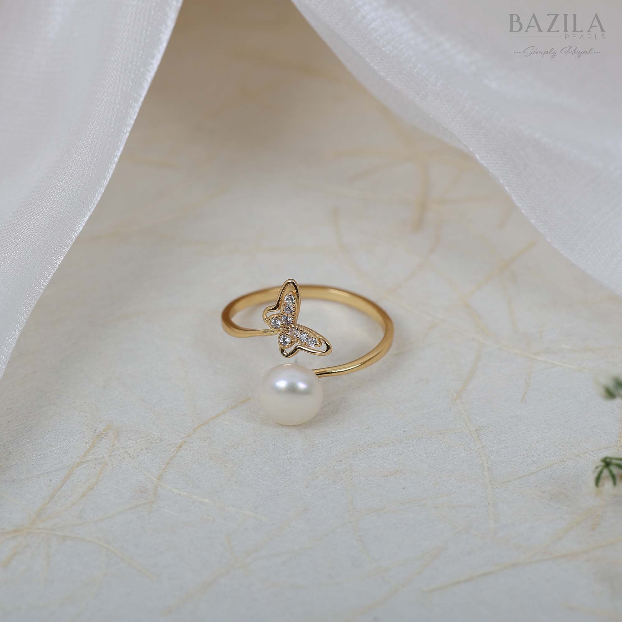 Gold Ring with Pearl Drop and Butterfly Sparkle