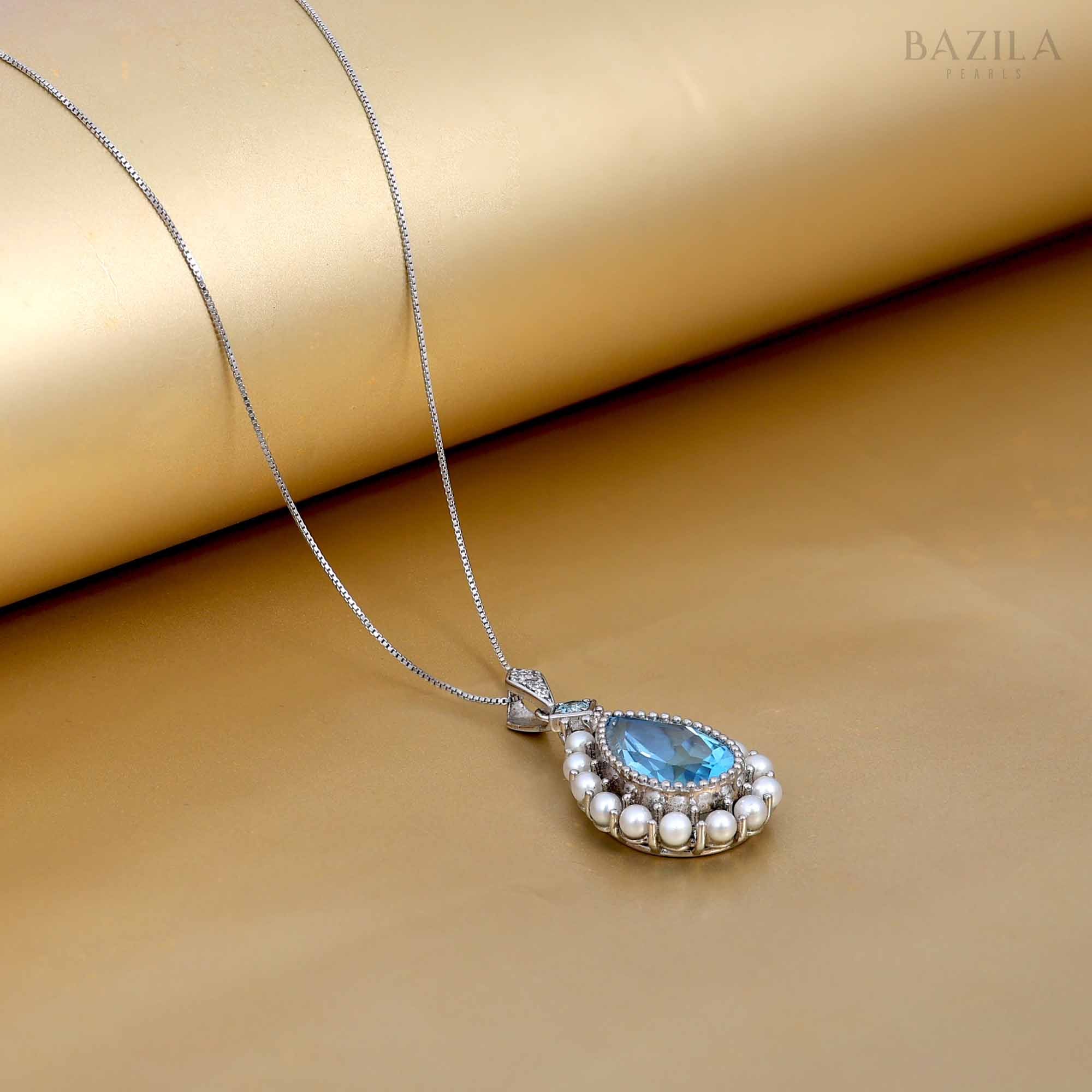 Elegant Blue Topaz and Pearl Teardrop Pendant