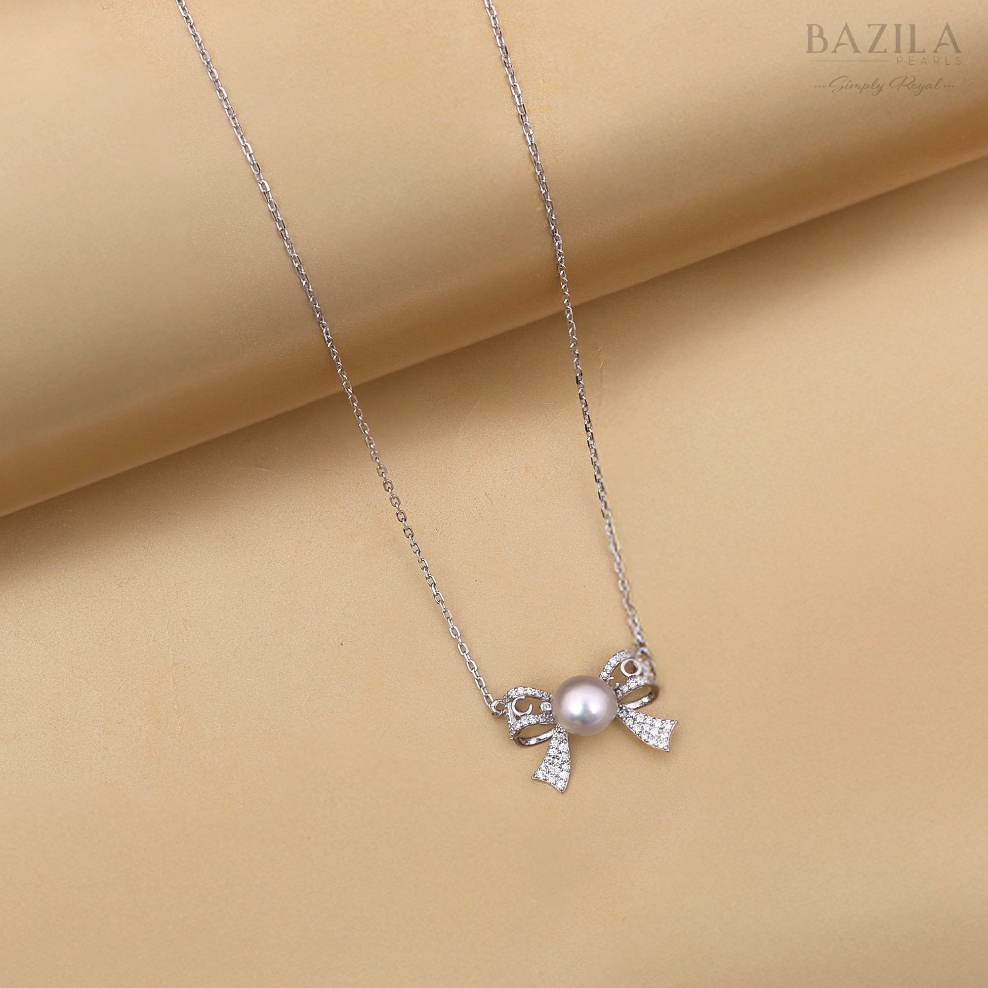 Seawater Cultured Pearl Pendant in Sterling Silver with Zircon-Accented Bow Design