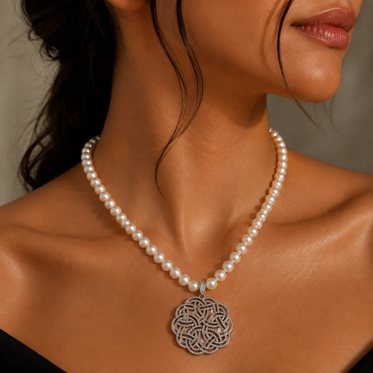 Elegant Pearl Necklace with Intricate Zircon Knot Pendant