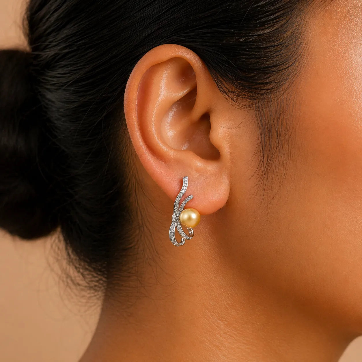 Golden Sea Pearl Earrings with Elegant Swirl Design