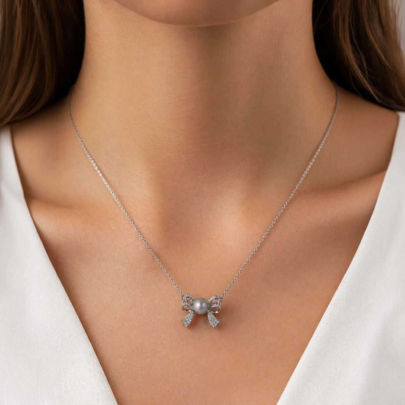 Seawater Cultured Pearl Pendant in Sterling Silver with Zircon-Accented Bow Design