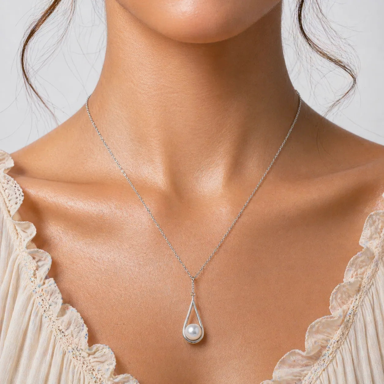 Elegant Akoya Pearl Pendant in Silver with Contemporary Drop Frame Setting
